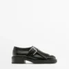 Derby-Schuhe mit Schnallen und Fransen Derby-Schuhe mit Schnallen und Fransen