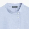Fließende Bluse mit geknöpftem Kragen Fließende Bluse mit geknöpftem Kragen