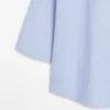 Fließende Bluse mit geknöpftem Kragen Fließende Bluse mit geknöpftem Kragen