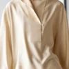 Fließende Bluse mit Latzdetail Fließende Bluse mit Latzdetail