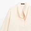 Fließende Bluse mit Latzdetail Fließende Bluse mit Latzdetail