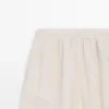 Fließende Sarouel-Hose mit Plissee-Detail Fließende Sarouel-Hose mit Plissee-Detail