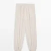 Fließende Sarouel-Hose mit Plissee-Detail Fließende Sarouel-Hose mit Plissee-Detail