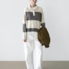 Gestreifter Strickpullover mit Poloshirt-Kragen Gestreifter Strickpullover mit Poloshirt-Kragen