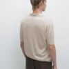 Gestricktes Poloshirt mit V-Ausschnitt Gestricktes Poloshirt mit V-Ausschnitt