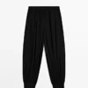 Halbtransparente Sarouel-Hose mit Knopfdetails