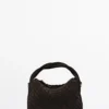 Kleine geflochtene Tasche aus Spaltleder Kleine geflochtene Tasche aus Spaltleder