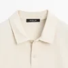 Langärmliges Poloshirt aus merzerisierter Baumwolle Langärmliges Poloshirt aus merzerisierter Baumwolle