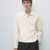 Langärmliges Poloshirt mit gerippten Details Langärmliges Poloshirt mit gerippten Details