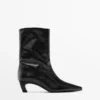 Leder-Stiefeletten mit hohem Absatz Leder-Stiefeletten mit hohem Absatz