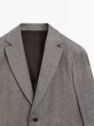 Maßgeschneiderter Blazer aus Leinenmischung mit Fischgrätenmuster Maßgeschneiderter Blazer aus Leinenmischung mit Fischgrätenmuster