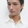 Piqué-Poloshirt mit langen Ärmeln und Knopfleiste Piqué-Poloshirt mit langen Ärmeln und Knopfleiste